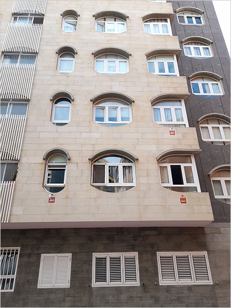 building in Gran Canaria with alarm installed signs